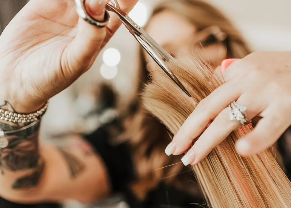 stylist cutting hair with shears